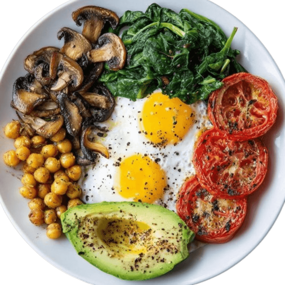 Assiette de poulet grillé aux herbes, œufs, épinards, tomates rôties et avocat